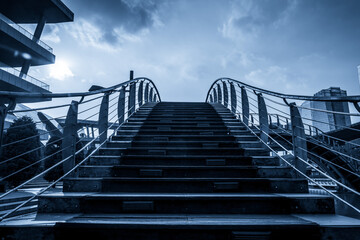 A Dramatic View of a Modern Bridge Against a Cloudy Sky