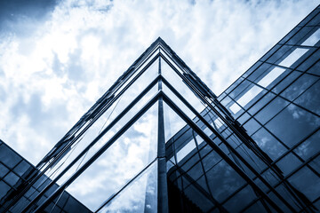 Modern Urban Architecture with Glass Facades and Dramatic Sky