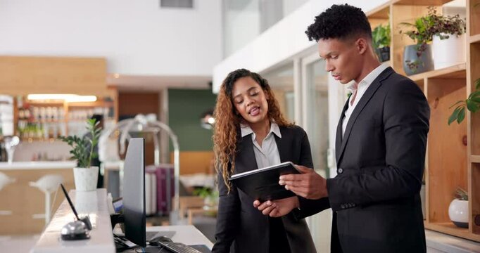 Hotel, reception and people with tablet in discussion for booking website, information or support. Man, woman and intern with tech at front desk for hospitality, online check in or help with training