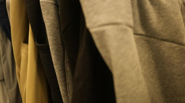 Pants on hangars in clearance section of department store