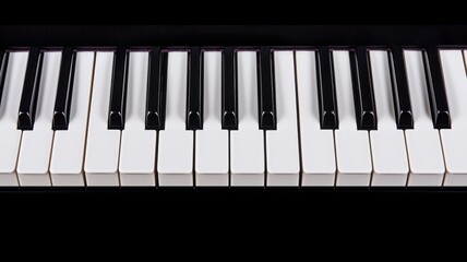 Fototapeta premium A close-up view of a piano keyboard highlighting the black and white keys, emphasizing the instrument's classic design.