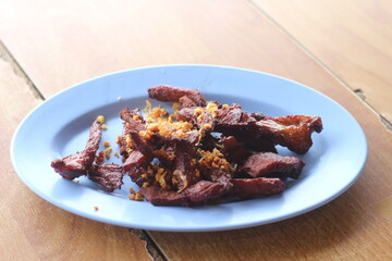 Fried beef with garlic on a plate