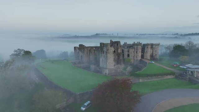 Raglan Castle in the fog at dawn, Monmouthshire, Wales, England