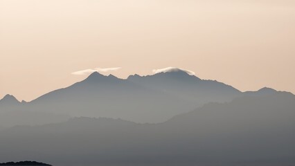 Generative AI, Minimalist Aerial View of Serene Mountain Ranges with Soft Cloud Layers