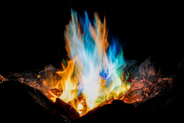 Ethereal Display of Colorful Flames Against Darkness
