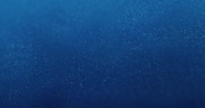 A deep blue background with subtle, shimmering particles. Ideal for corporate presentations, website headers, or digital media with a calm, professional aesthetic