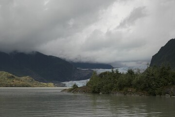 Glacier and Mountain Landscape Under Cloudy Sky
