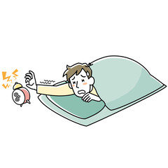 目覚しを止めようとする布団の中の眠そうな男性