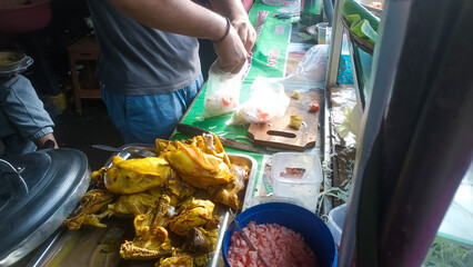 A man is mixing Lamongan soto spices 