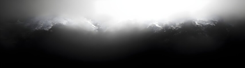 A dramatic sky with dark clouds illuminated by a bright light source, creating a moody and ethereal atmosphere that evokes a sense of mystery and awe.