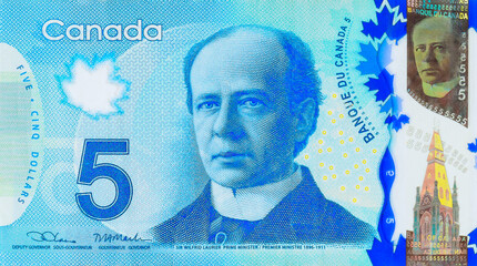 Bank of Canada issued by polymer banknotes in five dollar denominations front view