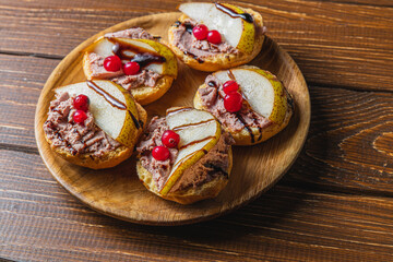 toast with chicken liver pate with pear and cranberry and sauce