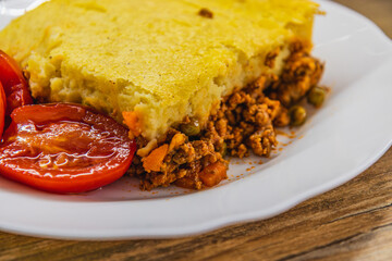 a piece of freshly baked shepherd's pie on a white plate