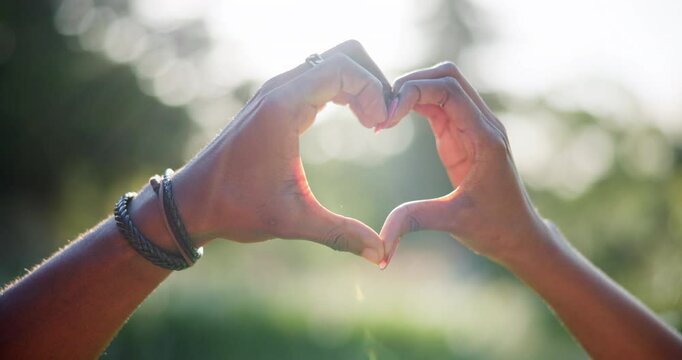 Hands, couple and heart sign for love outdoor with healthy relationship, commitment and marriage opinion. People, symbol and bonding together with loyalty, care and partner respect for romance trust