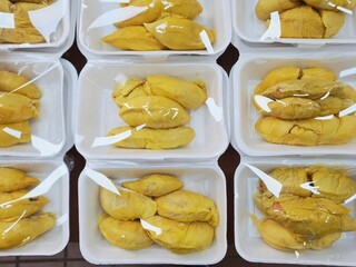 Flatlay of Pre-packed durian for sale in open air market in Singapore