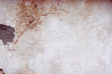 White concrete wall with natural defects. Fragment of the cement surface with natural texture. Monochrome palette of shades.