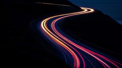 A Long Exposure of a Winding Road at Night with Blurry Light Trails