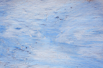 Blue peeling wall with natural defects. Fragment of the concrete shabby surface with natural texture. Blue white palette of shades.