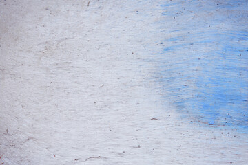Blue peeling wall with natural defects. Fragment of the concrete shabby surface with natural...