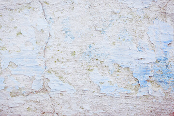Obraz premium Blue peeling wall with natural defects. Fragment of the concrete shabby surface with natural texture. Blue white palette of shades.