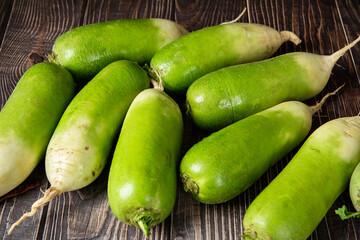 fresh chinese green radish on table.