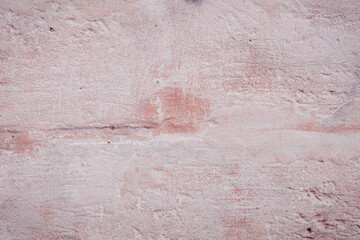 Grunge red concrete background. Textured plaster wall. Color of the year 2025 concept. Top view, layout for design. Surface with peeling shabby pattern.