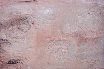 Grunge red concrete background. Textured plaster wall. Color of the year 2025 concept. Top view, layout for design. Surface with peeling shabby pattern.