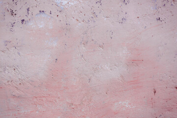Grunge red concrete background. Textured plaster wall. Color of the year 2025 concept. Top view, layout for design. Surface with peeling shabby pattern.