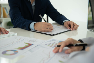 Business and Financial concept. Business team discussing assessment and evaluation of corporate showing the results of their successful teamwork.