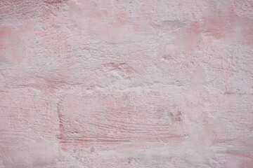 Grunge pink concrete background. Textured plaster wall. Color of the year 2025 concept. Top view, layout for design. Surface with peeling shabby pattern.
