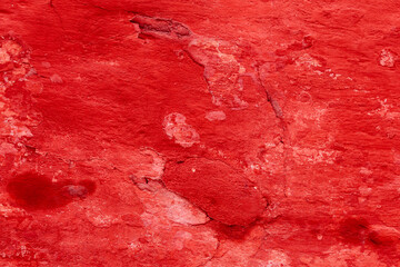 Grunge red concrete background. Textured plaster wall. Color of the year 2025 concept. Top view, layout for design. Surface with peeling shabby pattern. © TS-photo