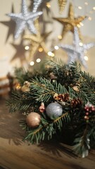 Elegant holiday decoration featuring an evergreen garland with baubles and pinecones, set against sparkling Christmas star lights.