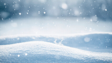 Winter landscape with falling snowflakes and snow drifts. Christmas background with copy space