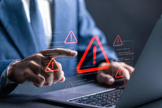 Ransomware malware attack and data breach. Businessman using laptop with spam virus on warning caution for notification on internet security protect.