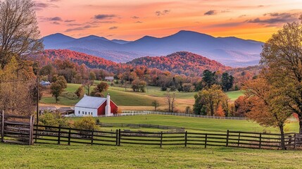 A small white farmhouse with a red roof sits in a valley with a beautiful sunset over the mountains.