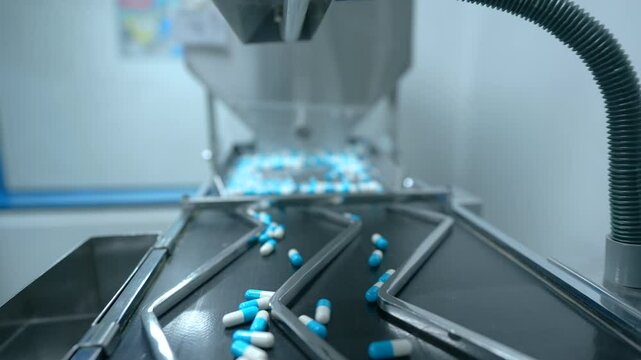 capsule pill making machine. automatic semi machine filling capsule shells. pill making process in a pharma factory. bulk capsule medicine making machine. automatic machine filling capsules pills. pil