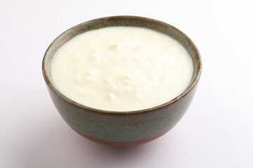 Homemade dahi doi or sour cream or curd or yogurt in a ceramic bowl. Curdled milk. Probiotic food or Probiotic dairy product. It is popular Indian dessert.