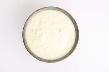 Homemade dahi doi or sour cream or curd or yogurt in a ceramic bowl. Curdled milk. Probiotic food...