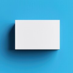 Fototapeta premium Minimalist white box mockup on a vibrant blue background for branding and design purposes.