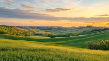Obraz premium A serene landscape at sunset, showcasing rolling hills and lush greenery.