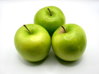 Green apples on a white background. The Freshness of green apple. An apple has a lot of vitamin C.