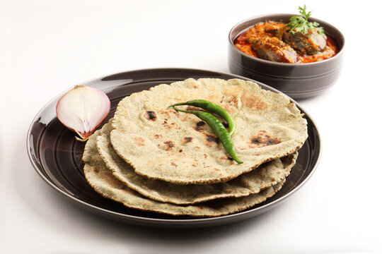 Roti or millet flat bread.Made with chana ,caun, green moong , udad ,ragi , Jowar farmer's lunch Indian bread with Brinjal curry