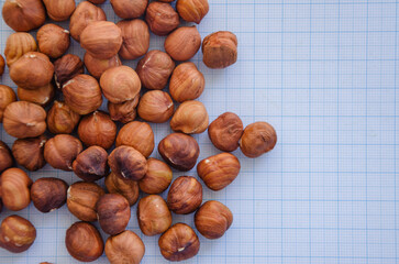 hazelnuts without shell on a light background in a check
