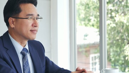 Businessman hands note meeting document in conference room. man Hands writing planning notebook. Close up male hand holding pencil write on diary sketchbook at office desk. Business Planning Concept