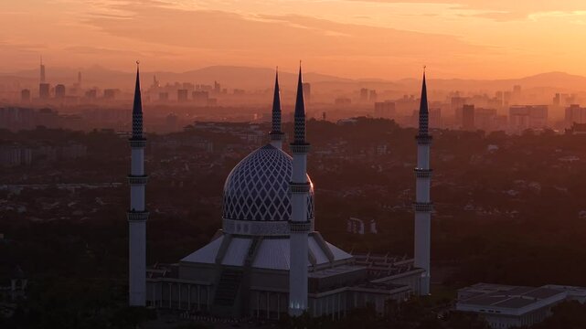 malaysian mosque Masjid Sultan Salahuddin Abdul Aziz Shah during beautiful sunrise aerial shot
