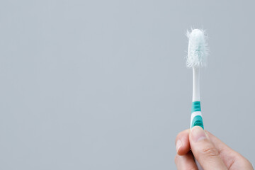 A damaged toothbrush is a breeding ground for germs and bacteria, which can cause swollen gums.