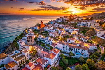 Fototapeta premium Aerial Sunset View of Torrox, a Picturesque White Town on Costa del Sol, Showcasing Mediterranean Charm and Ocean Views in Andalusia, Spain
