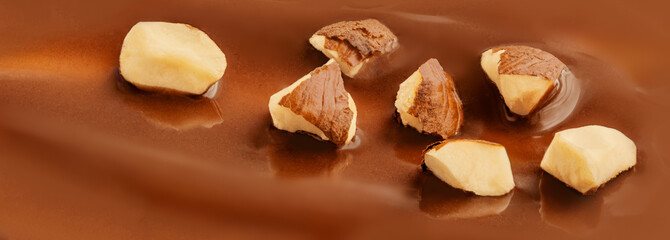  Melted Chocolate texture Background with nuts. Hazelnut Chocolate sauce pattern. Dark chocolate swirl wallpaper.