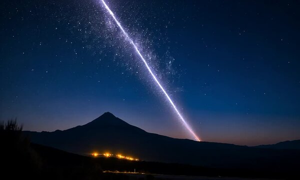 A comet streaks across a twilight sky over a mountain landscape.