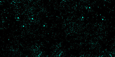 Abstract small shiny particles with different scale covered dark background. Colourful glowing Christmas garland with blur background and bokeh